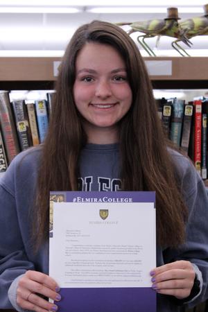 a girl holding a certificate