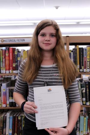 girl holding a certificate