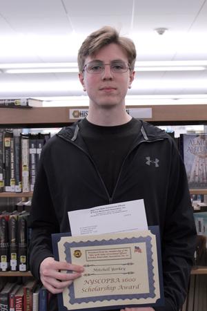 boy holding a certificate