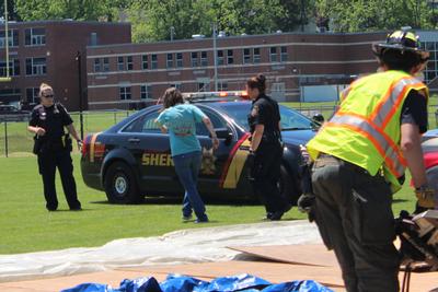 police conduct a sobriety test on a girl