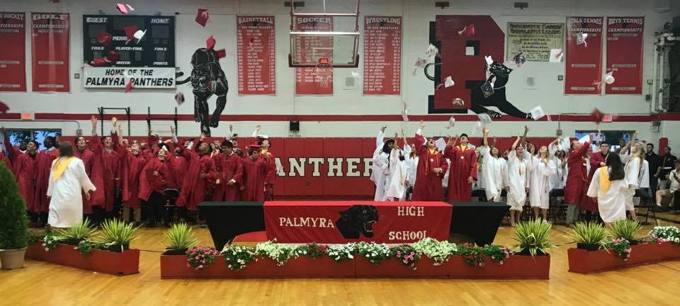 Students wearing cap & gown in PHS gym graduation-2019