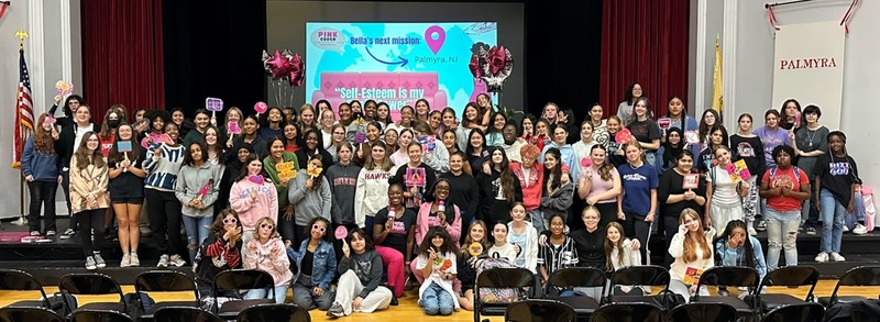 PHS| MS 7th, 8th & 9th grade girls pose for a photo after a pink couch presentation