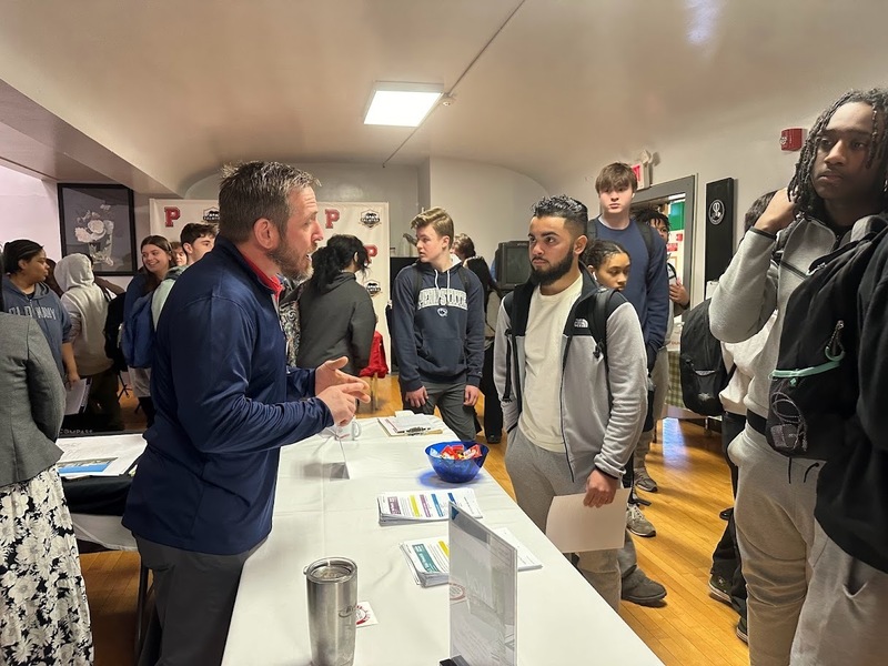 students hearing from vendors at the career fair 2024