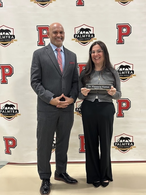 Mark Pease & Florencia Norton holding her new name plaque