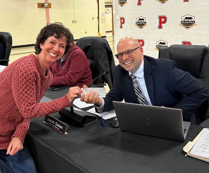 PHSFEE check being handed to Mr. Toscano by Ms. Demas (the real check- prompting Mr. Toscano's impressive smile)