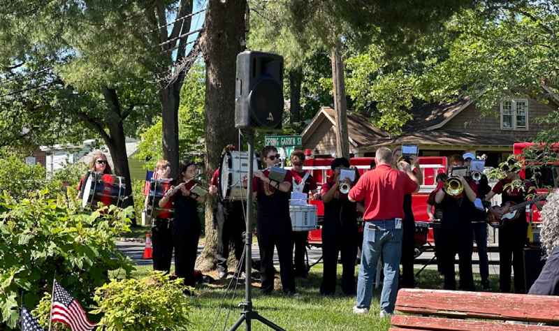 Band Director, Mr. Jeffrey Moore conducts the Marching Band playing the Marine Corps Anthem