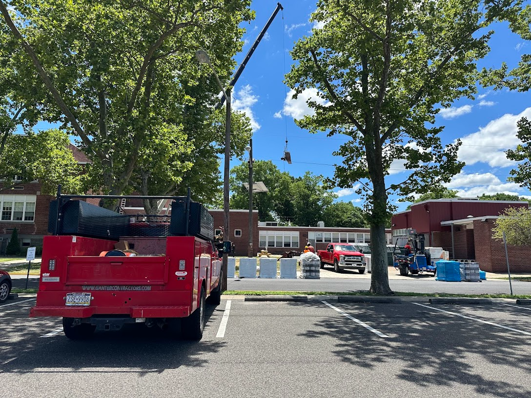 supplies being lifted by crane to the roof of PHS/MS