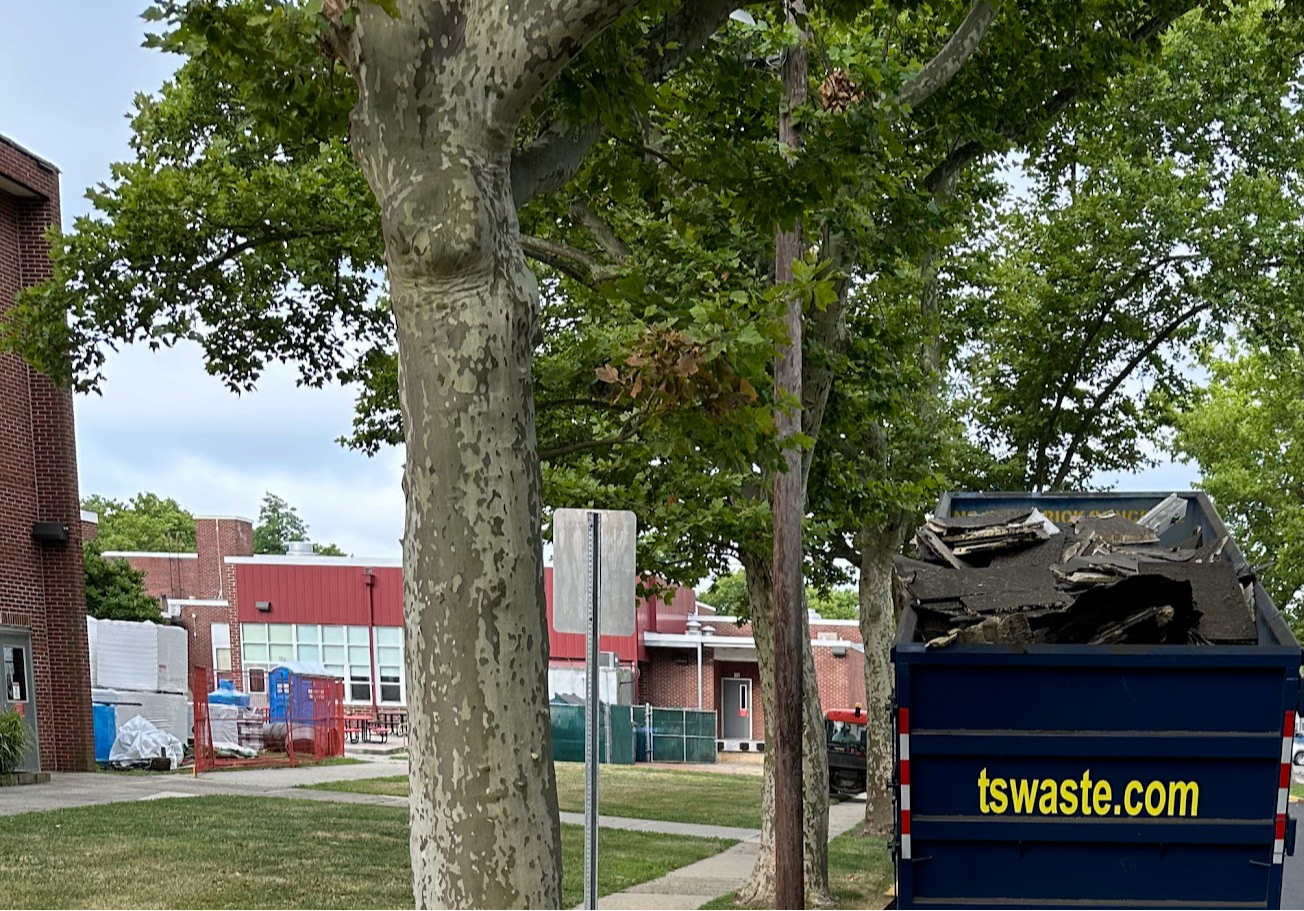 another truckload of old roof being carted away