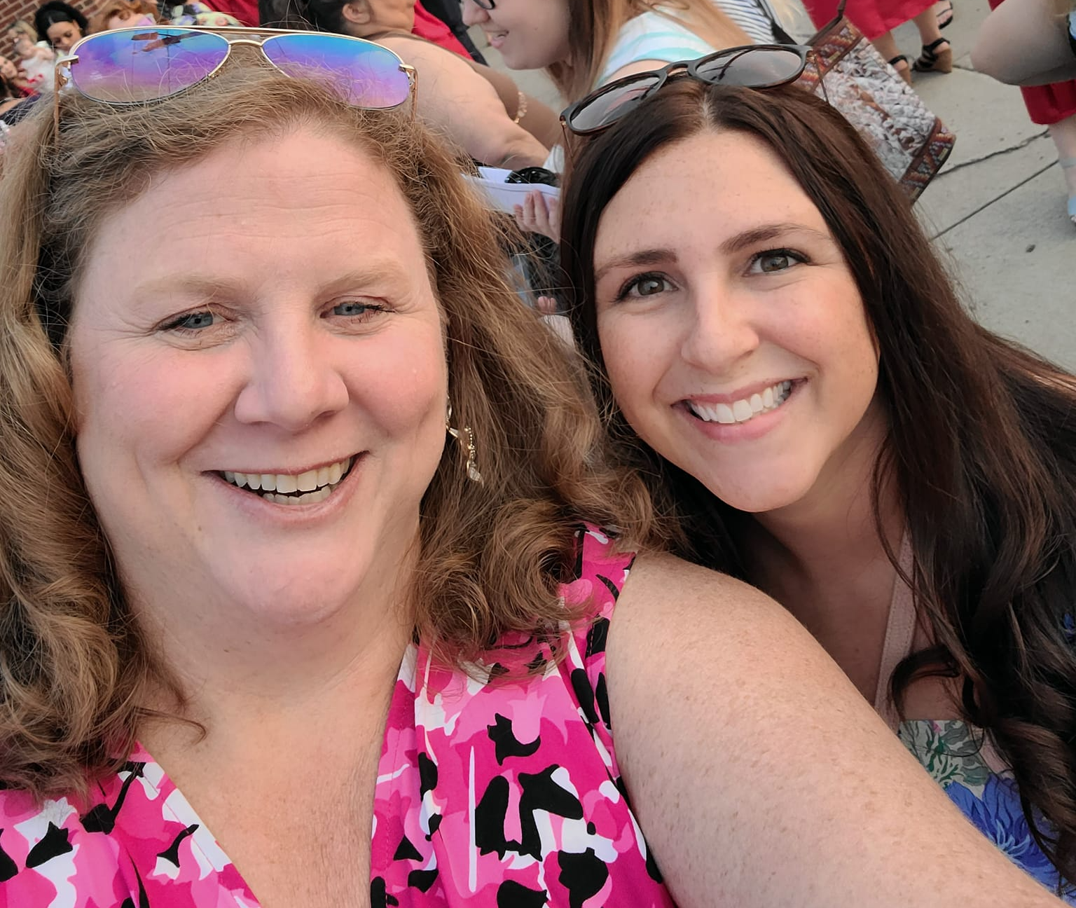Selfie of StuCo advisors with  families in the backgroundn