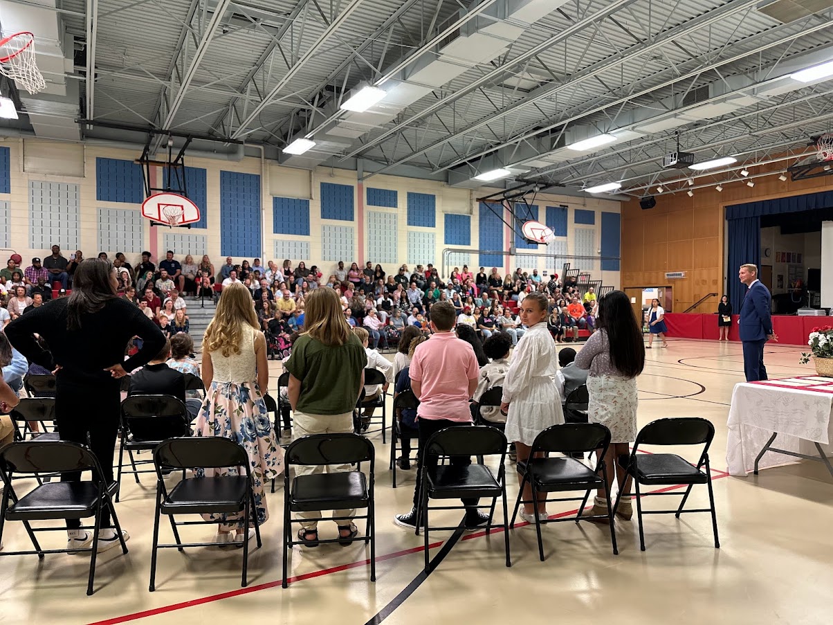 a student takes a quick peek to see how much longer to wait