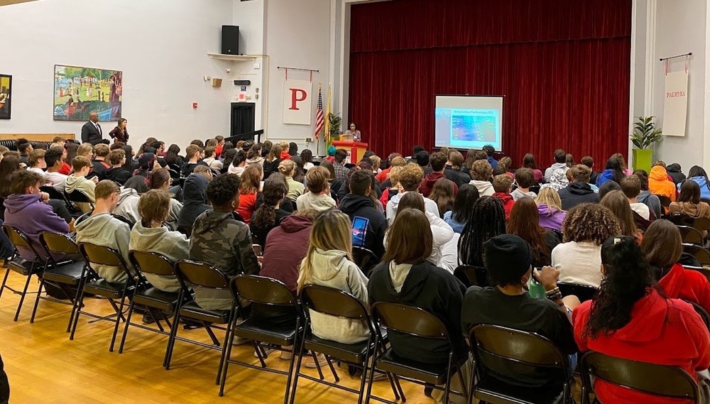 students seated in auditorium for Aspire assembly