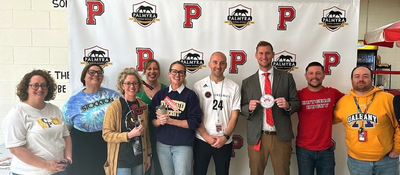 PHS Admin & Staff wearing their college colors in a group shot