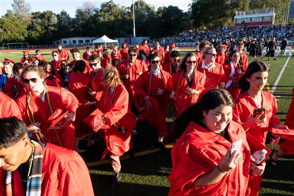 Running Off the Field at Graduation