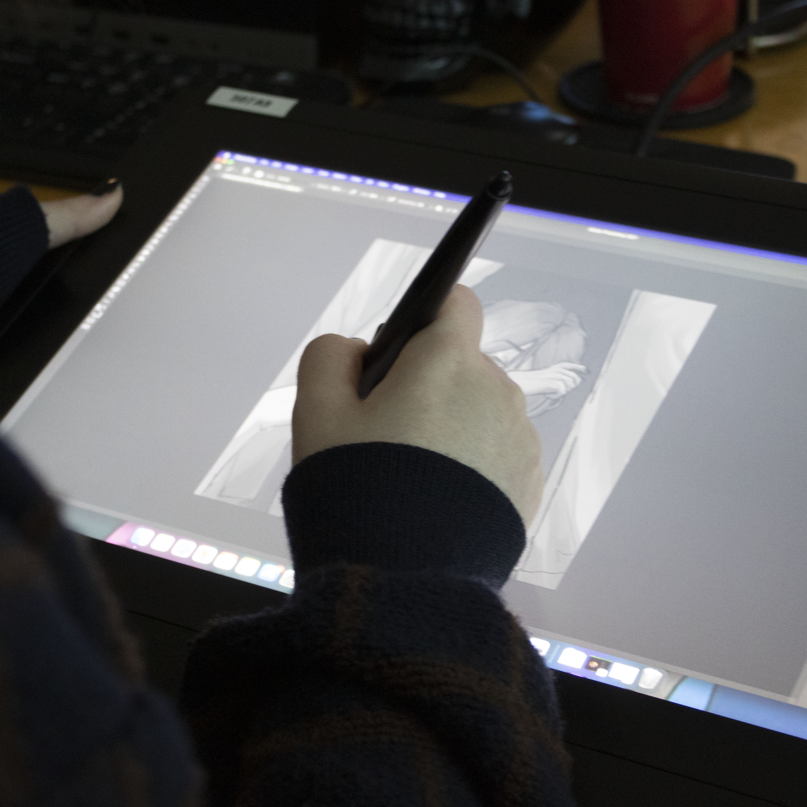 student designing on screened drawing tablet