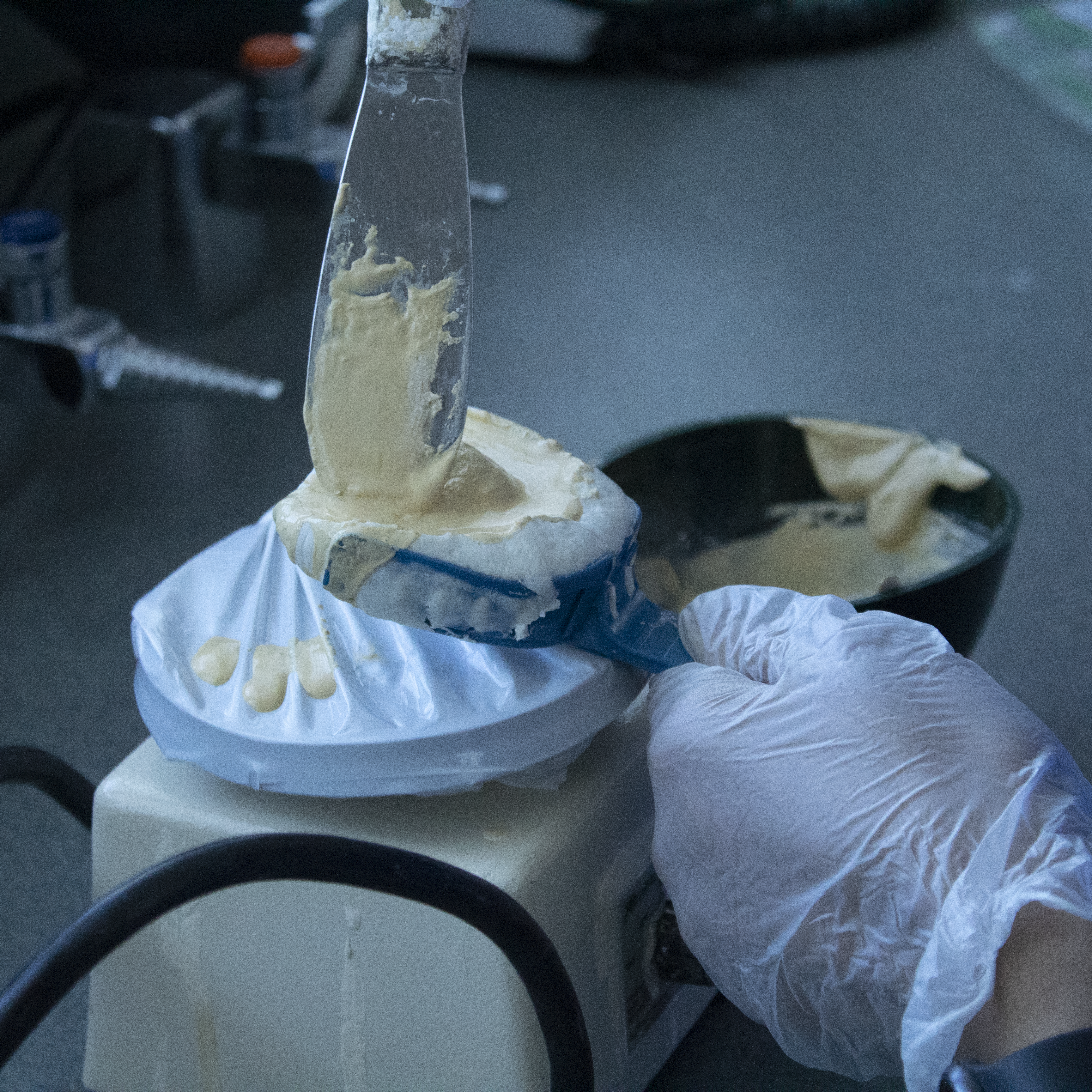 student mixing dental paste materials