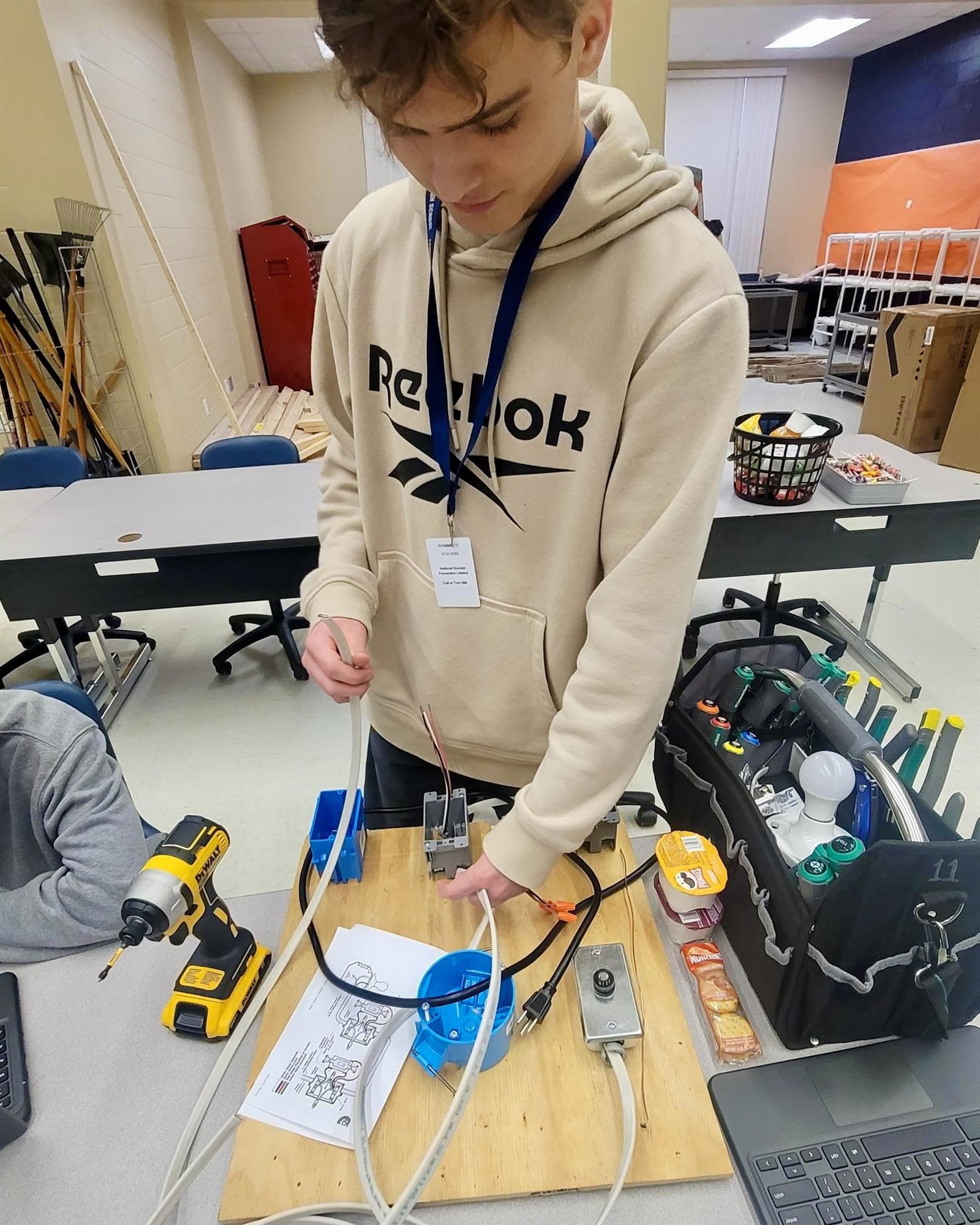 Technician working on electrical equipment